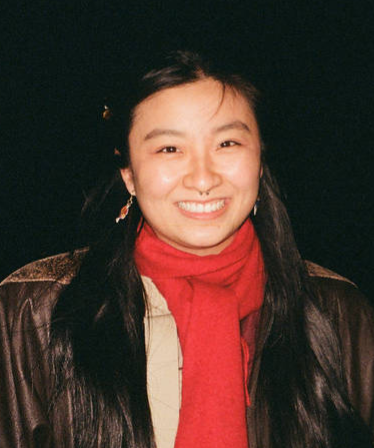 Connie in leather jacket and red scarf